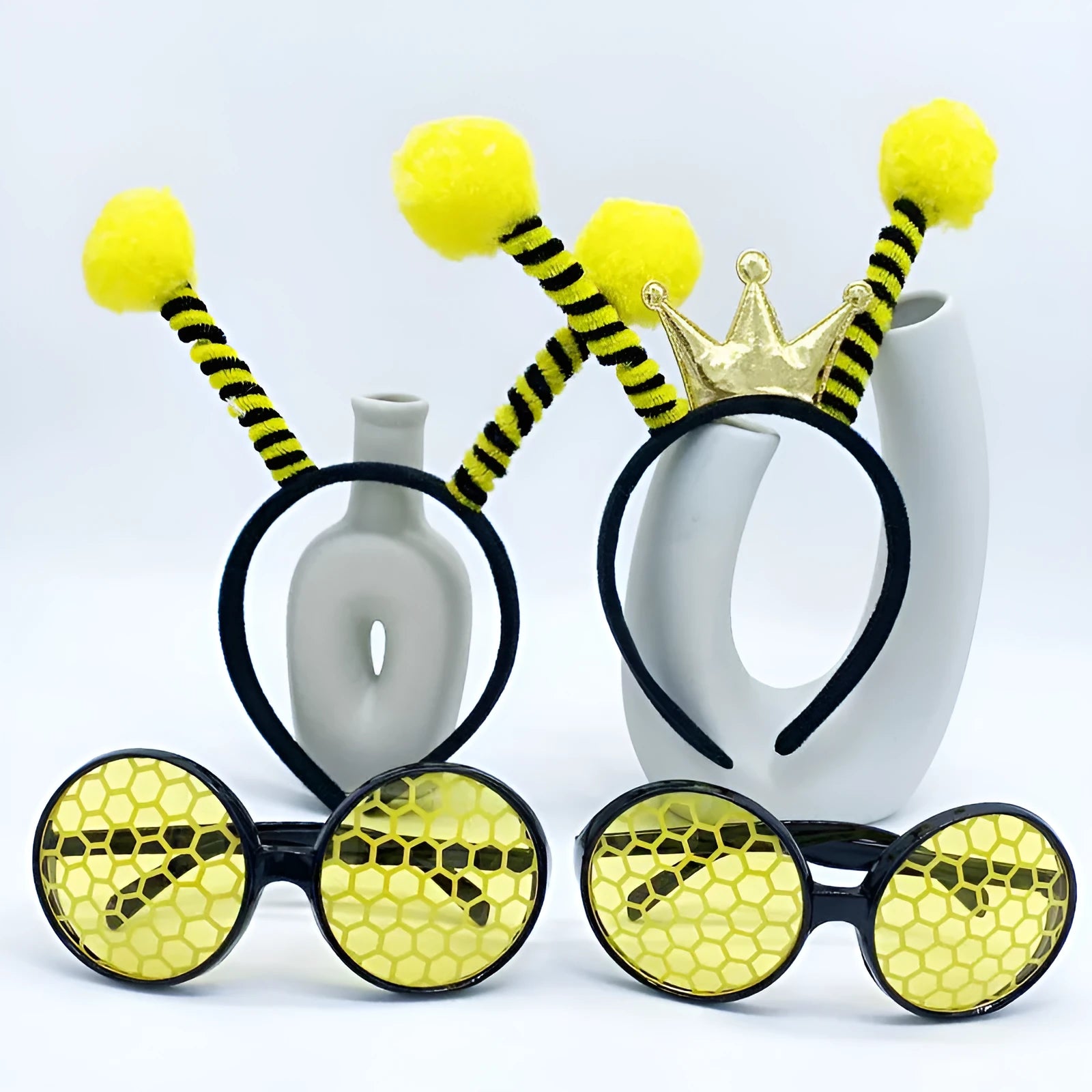 Yellow and red bee costume headband and matching black frame glasses for children's dress-up.