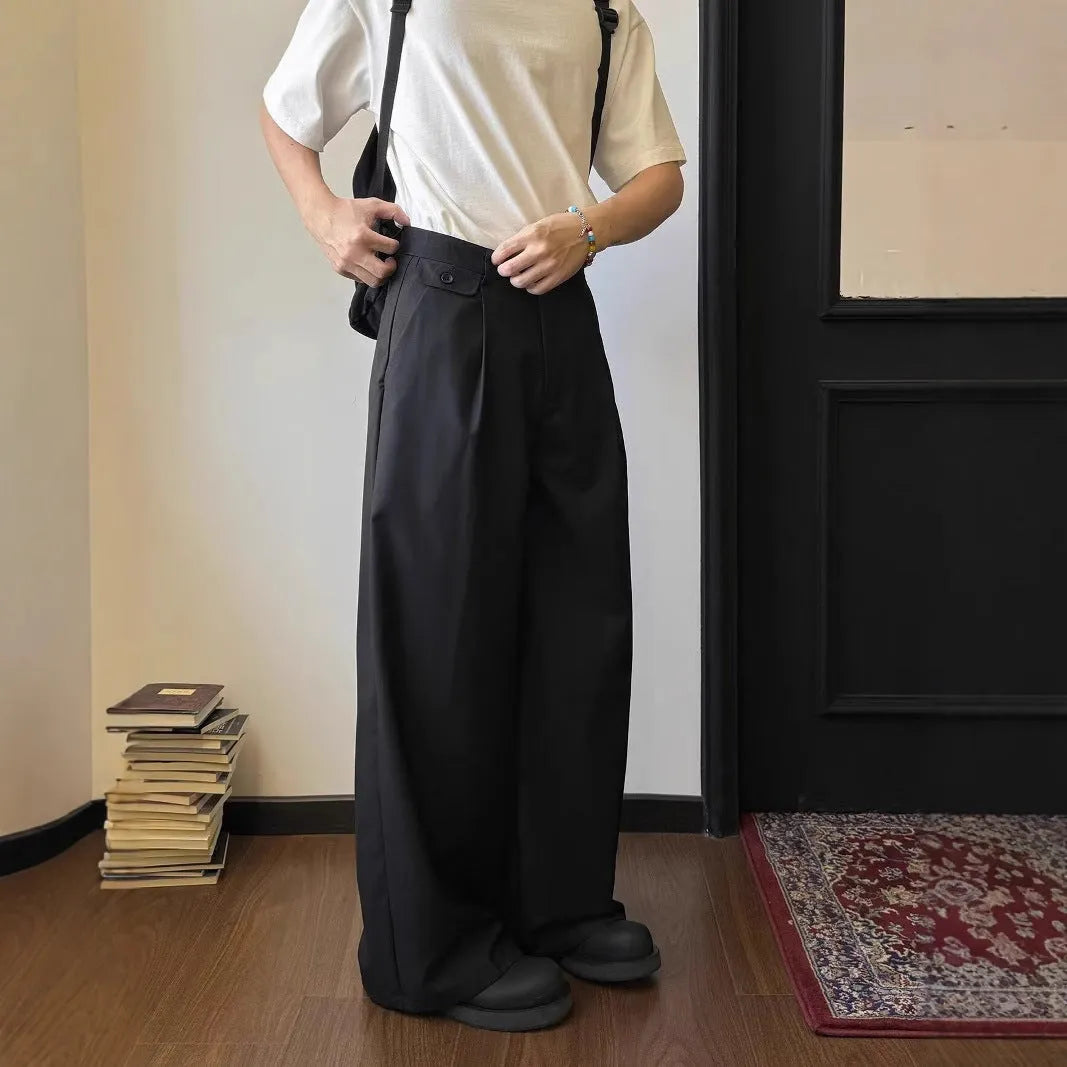Men's straight-leg suit trousers in brown with wide-leg fit showing front and side views.