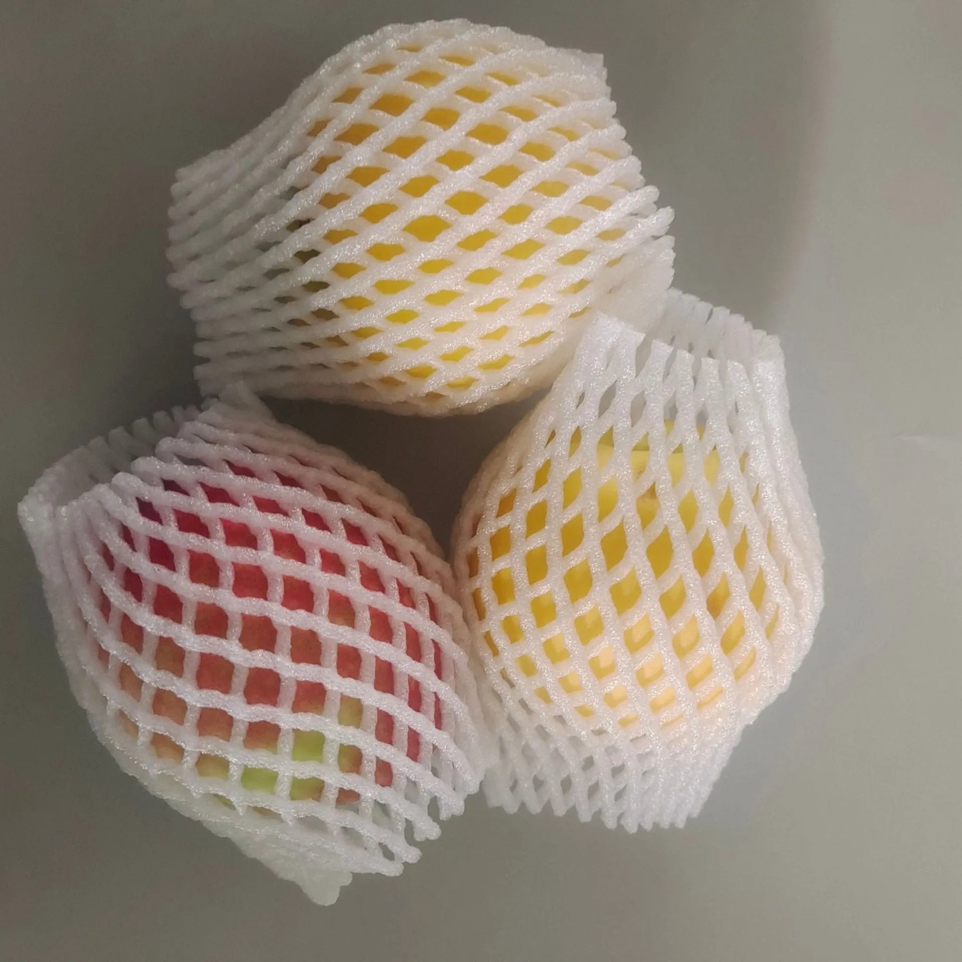 White foam fruit net cover shockproof protective case shown in multiple sizes for delicate fruit transport