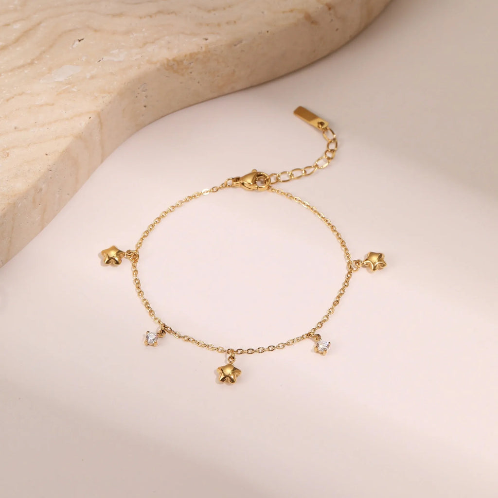 Women's stainless steel bracelet with 18K gold plating and zircon geometric star pendant