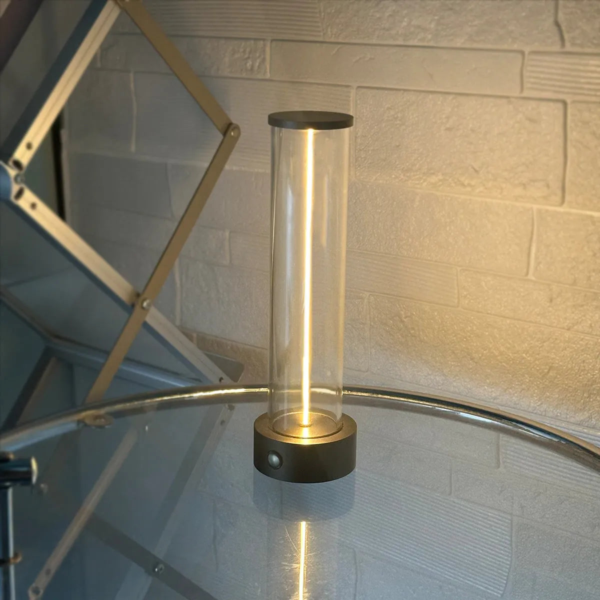 Modern glass LED light strip with magnetic back, measuring 234mm high, on a metal surface.