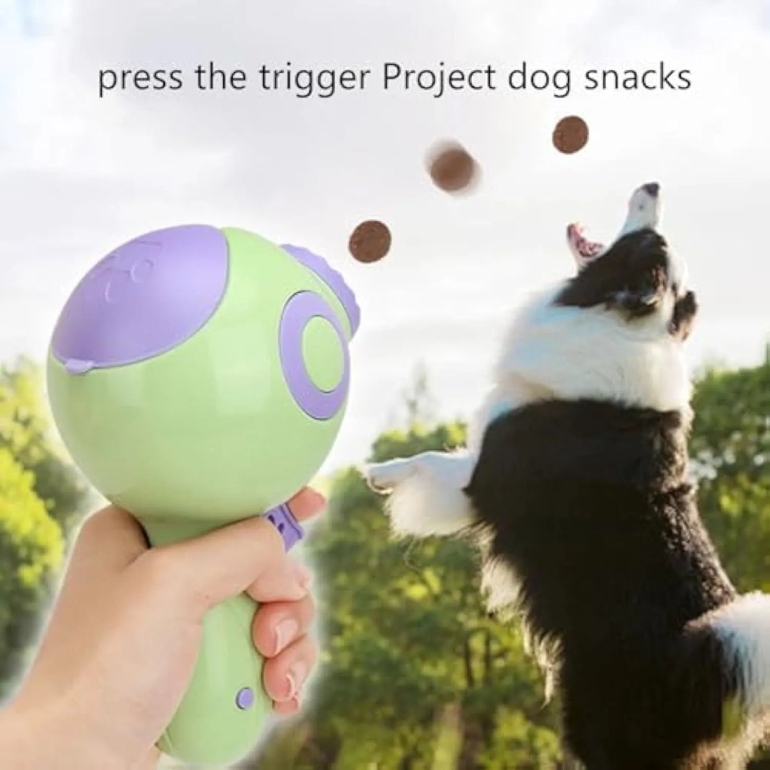 Green orange pink dog treat launcher toy for interactive feeding and training play