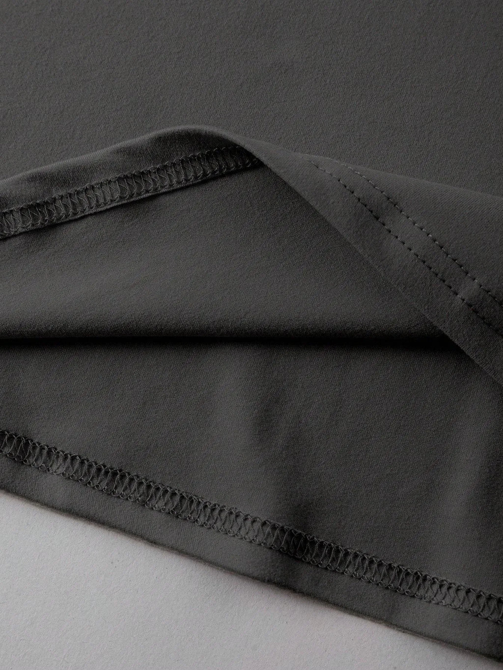 A loose-fit cotton T-shirt in a straight cut style with short sleeves and a round neck.