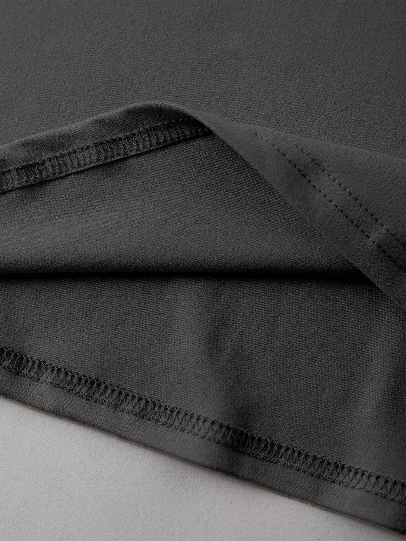 A loose-fit cotton T-shirt in a straight cut style with short sleeves and a round neck.