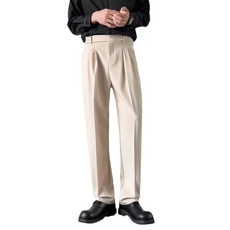 Men's straight loose fit suit trousers in apricot colour on a hanger.