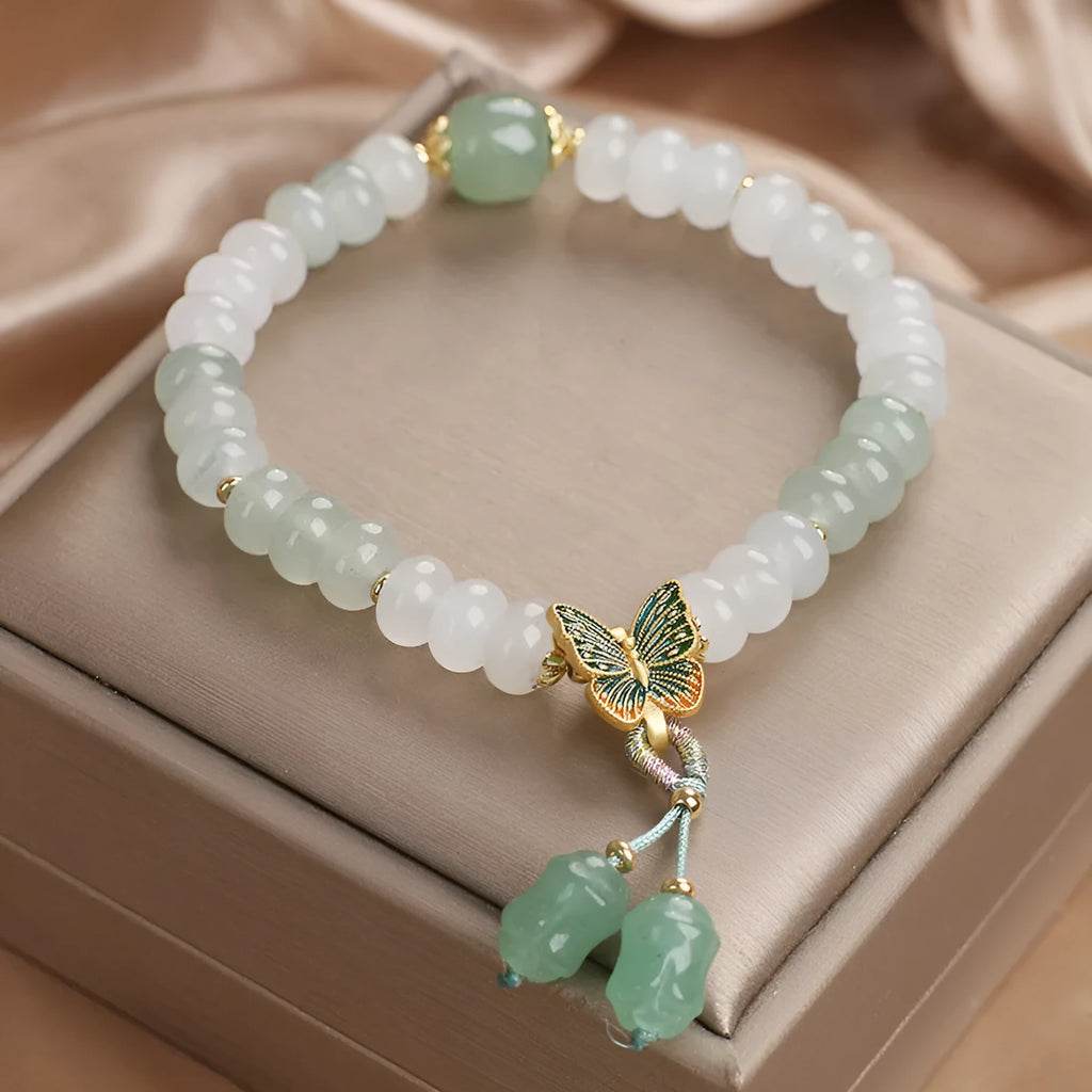 Green retro butterfly tassel bracelet with crystal beads, pearls, and rhinestones