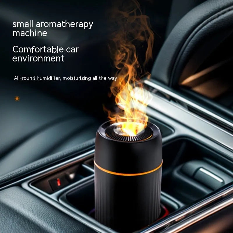 Black and white car aroma diffuser with simulation flame effect on a car console.