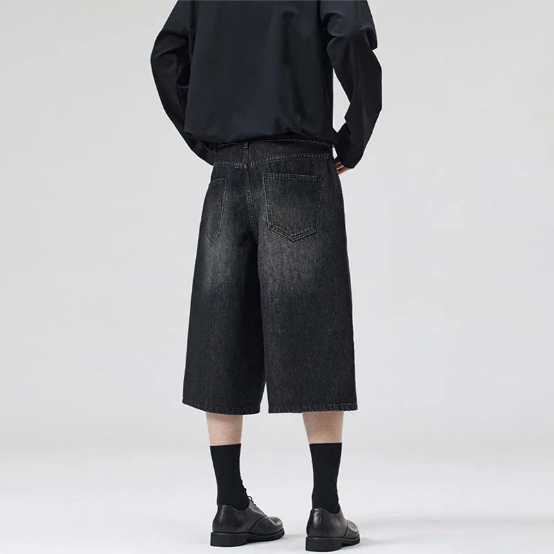 Cropped straight-leg denim shorts in light blue colour showing loose fit styling