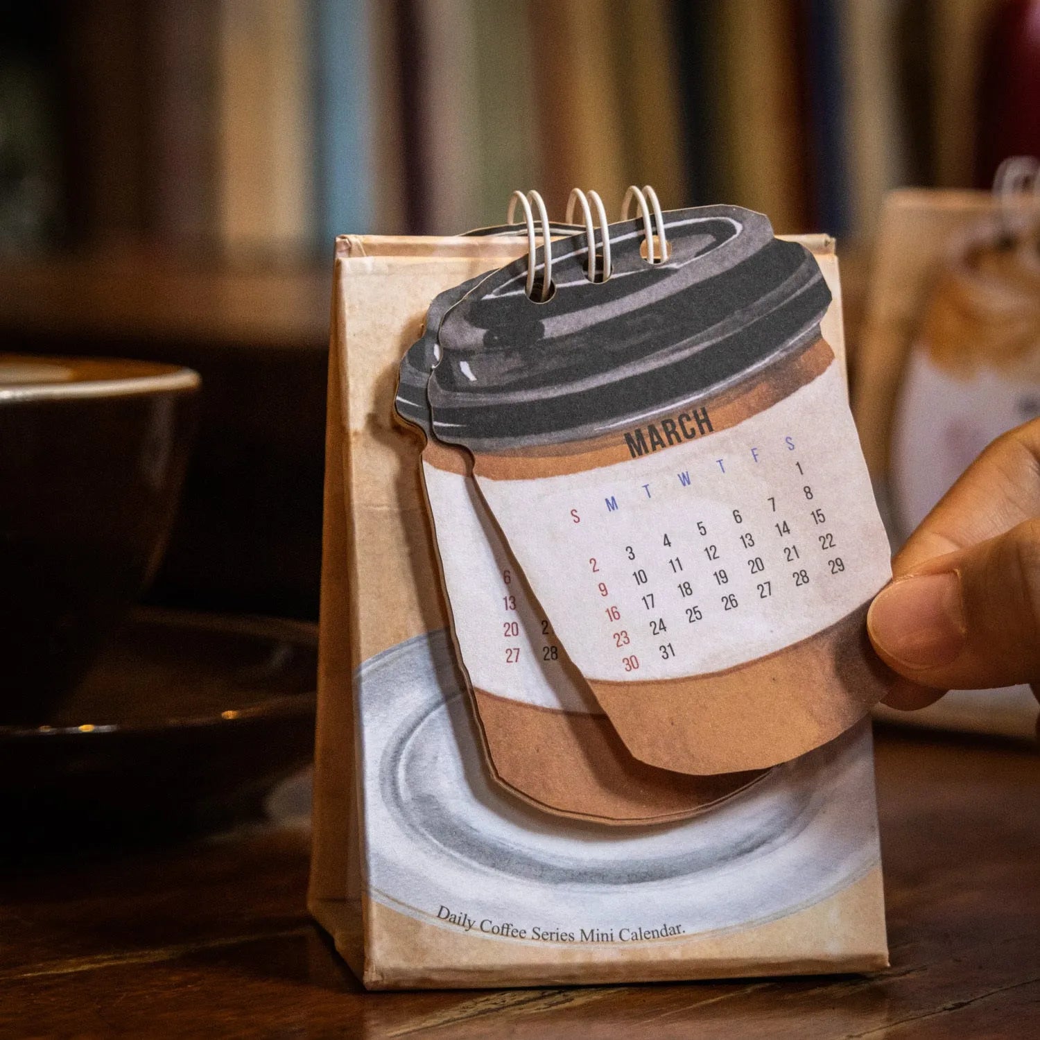 Coffee mini desk calendar 2025 showing modern paper design with monthly date display