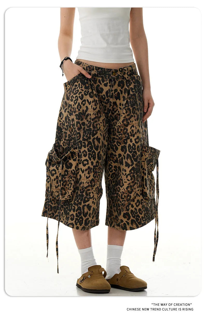 Leopard print women's trousers with high waist, button fly, and cropped straight-leg design