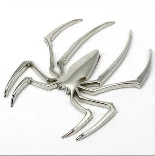 Three-dimensional metal spider car sticker in gold, silver, black, or red.