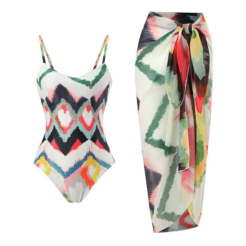 Women's striped two-piece swimsuit set with a matching hip skirt on a neutral background