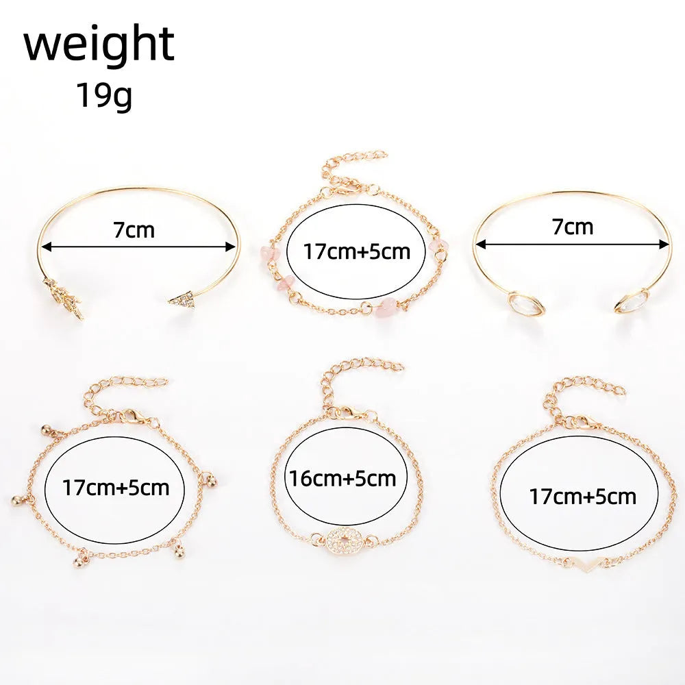 Gold tone six piece women's bracelet set with water droplet and arrow designs