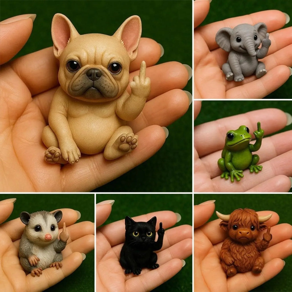 Small resin animal figurine on desk giving middle finger, 5cm tall.