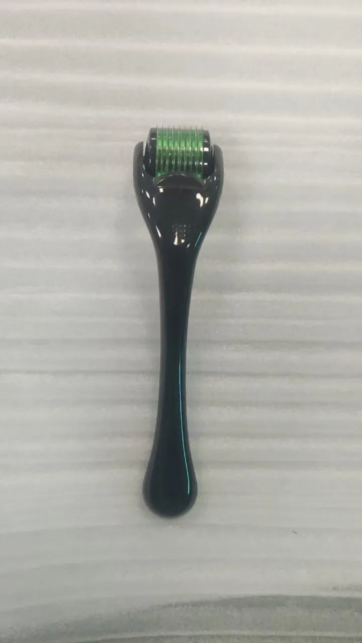 Sterile 540 micro needle derma roller showing handle and needle wheel in assorted colours.