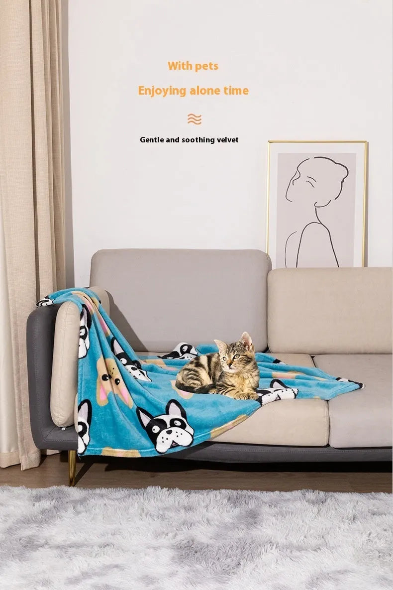 Blue cartoon dog pattern double-sided flannel pet blanket laid flat, showing its size next to a pet crate.