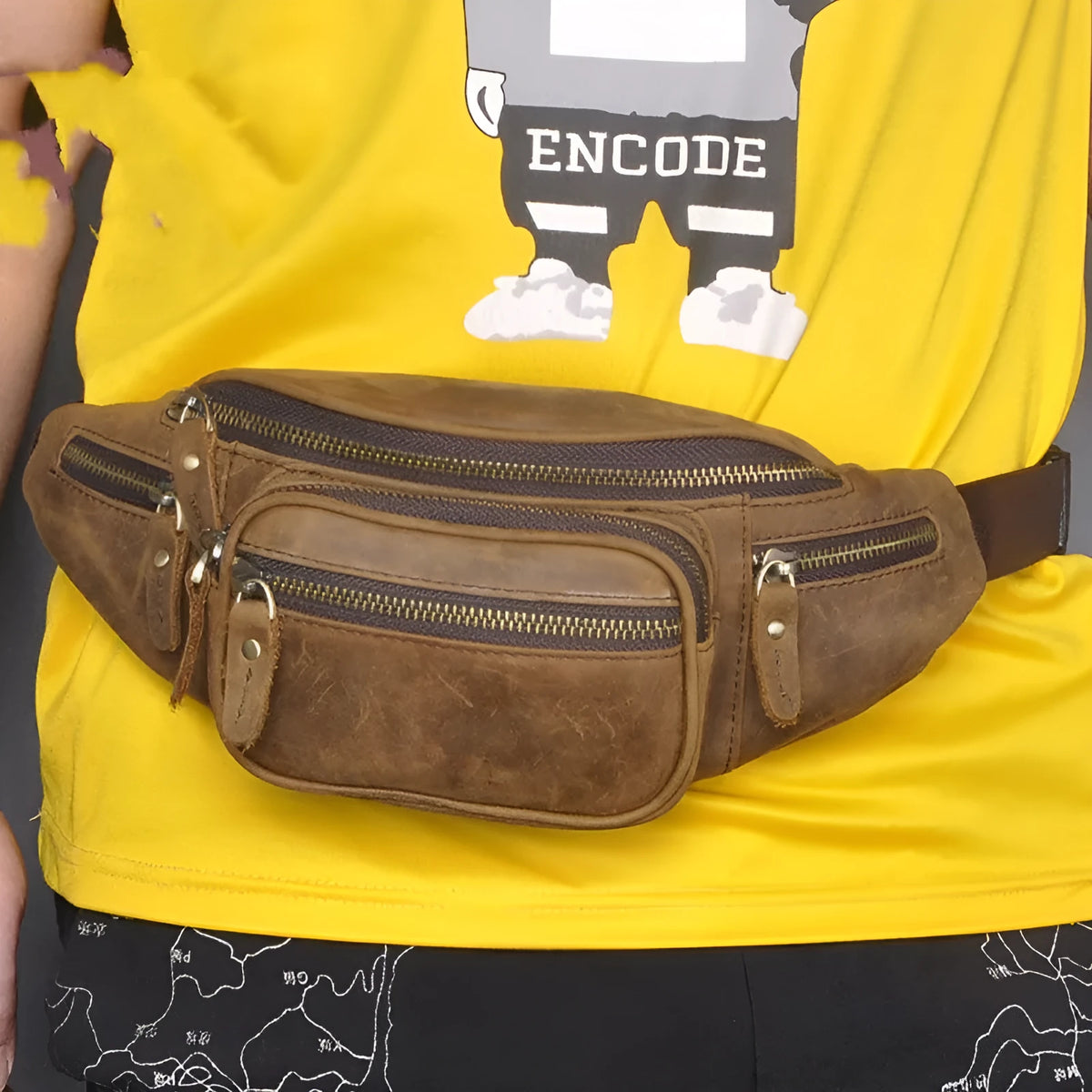 Dark brown leather messenger bag with a single shoulder strap showing its 32cm length and spacious main compartment