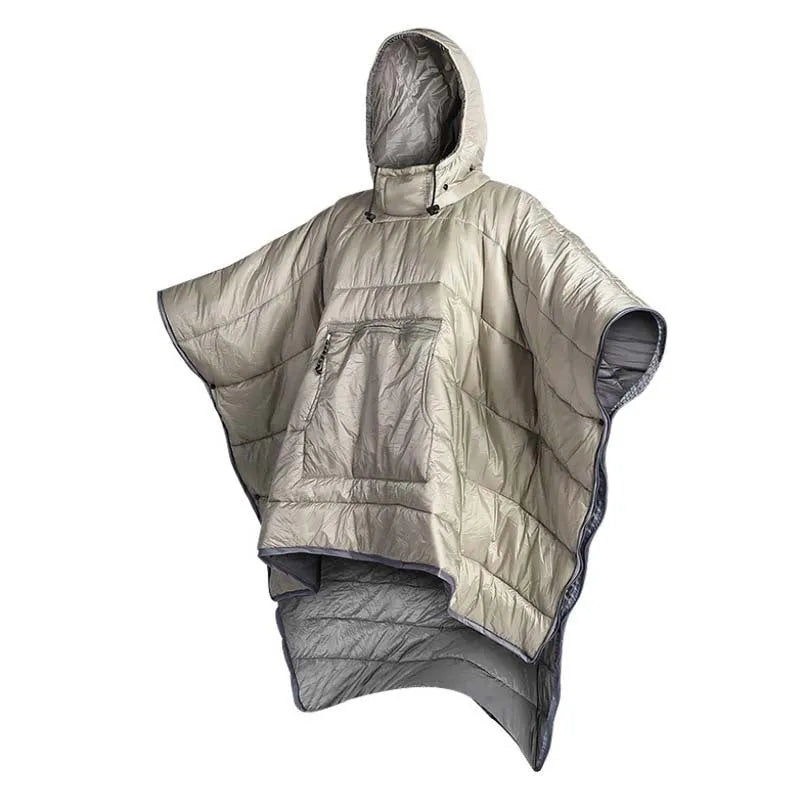 Adult wearing a gray hooded outdoor cloak that converts into a sleeping bag, shown laid flat at 200cm x 140cm.