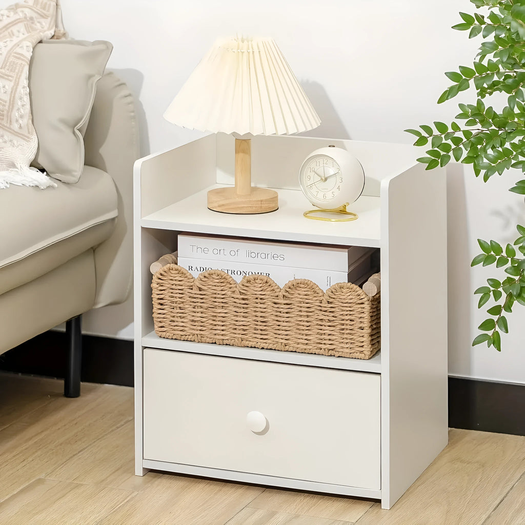 Rectangular woven paper storage basket in khaki colour on a wooden table.