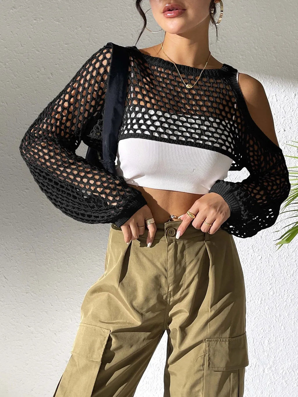 Mesh beach shirt with hollowed navel design in multiple colours on a mannequin.