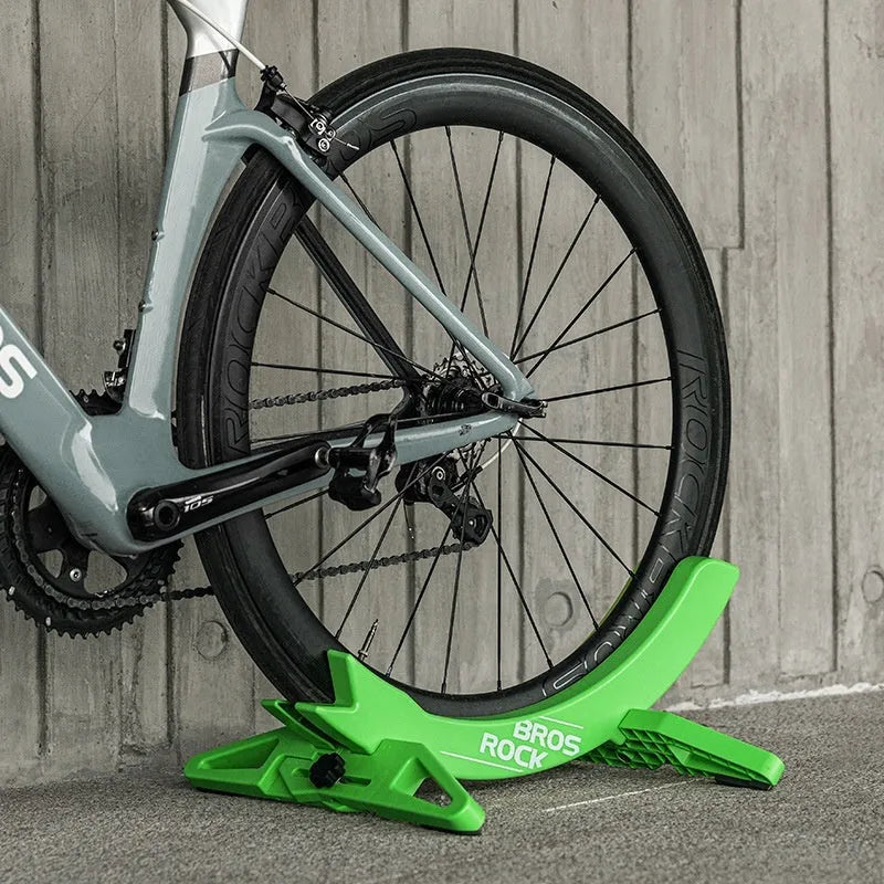 Black ABS plastic wall-mounted bike parking rack holder for road and mountain bicycles.