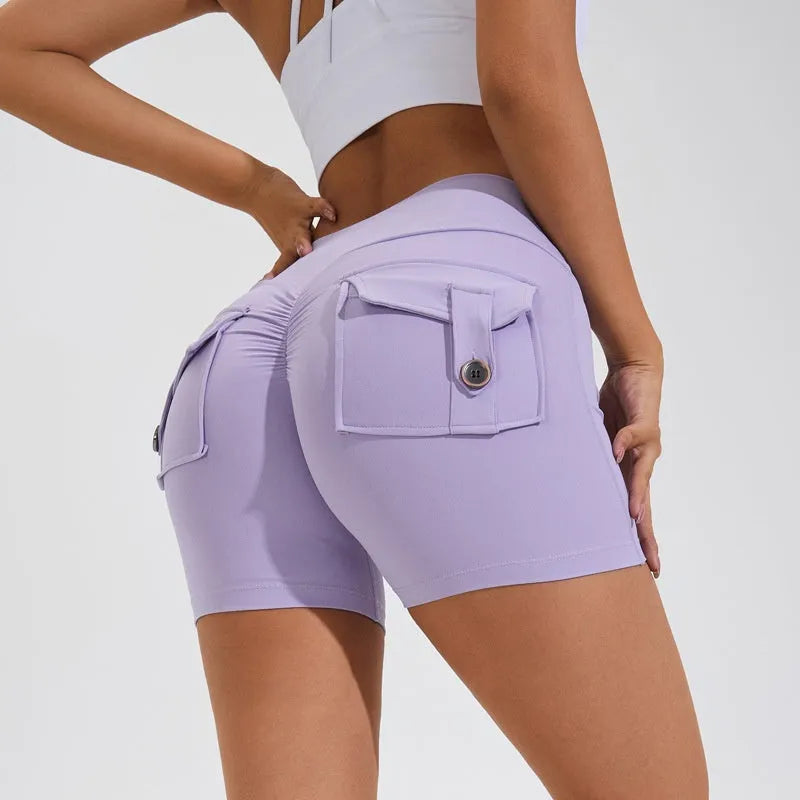 Women's high waist nylon fitness shorts with pockets in avocado green colour.