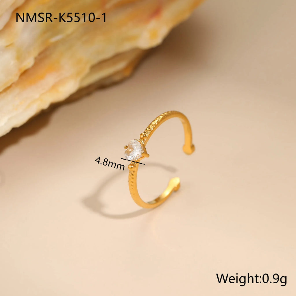 Adjustable open-ended stainless steel ring with heart-shaped zircon design in three colour options