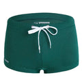 Man's low-waist nylon lace swimming trunks in a boxer brief style, shown in a solid colour.