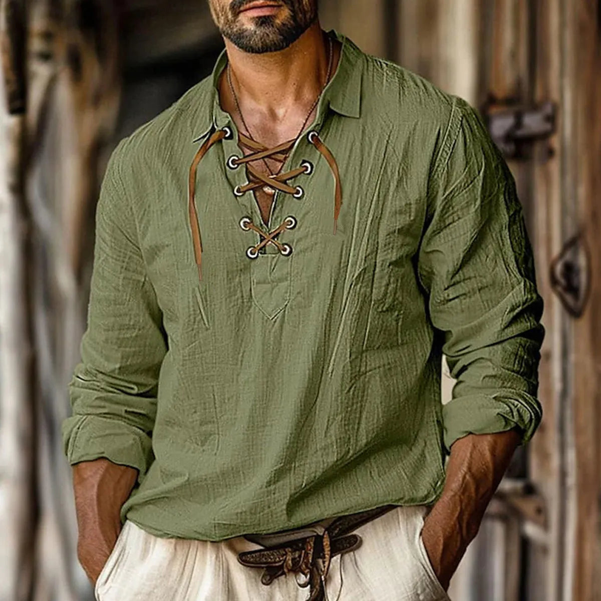 Men's loose fit blue linen blend shirt with lace-trimmed lapel collar and long sleeves.