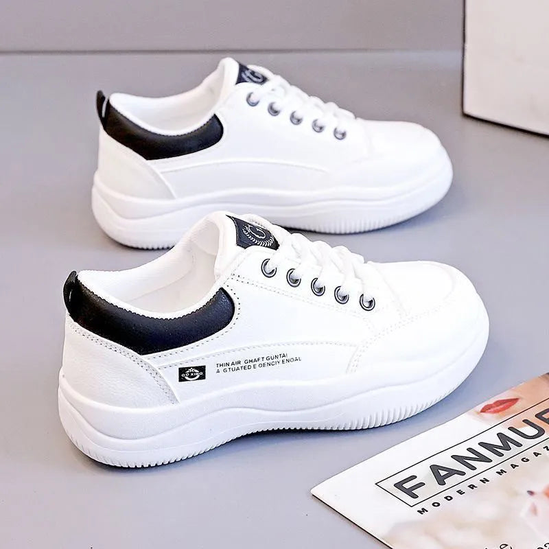 Women's white Korean-style lace-up pumps with cross straps and round toe, showing leather stitching details