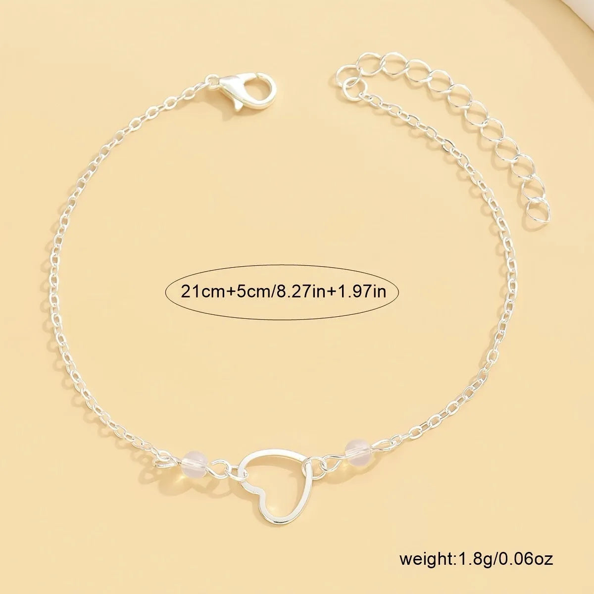 Gold or silver adjustable alloy anklet for women featuring a heart-shaped pendant.