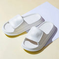 Thickened EVA flip-flop slippers in multiple colours showing the sole thickness.