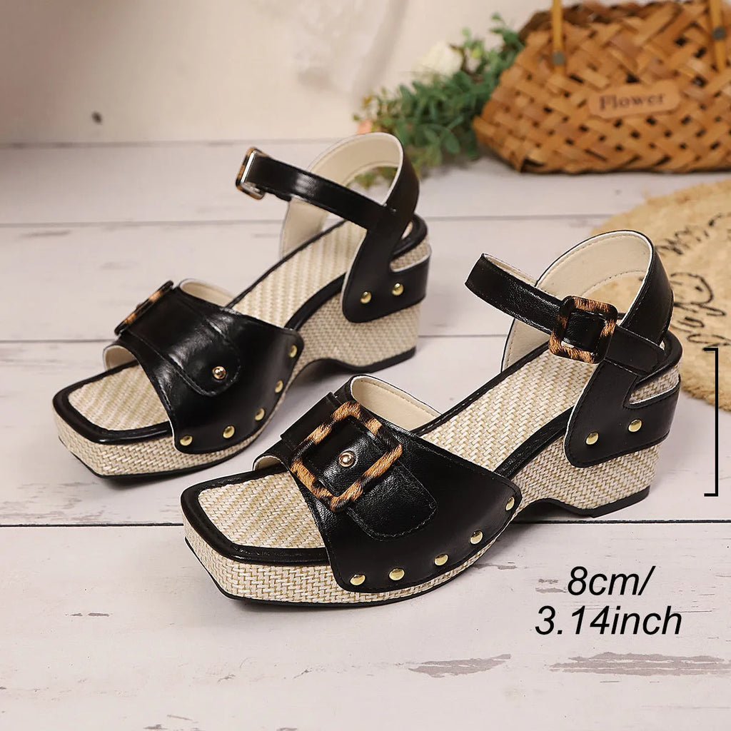 Women's black chunky heel sandals with metal buckle closure and square toe design