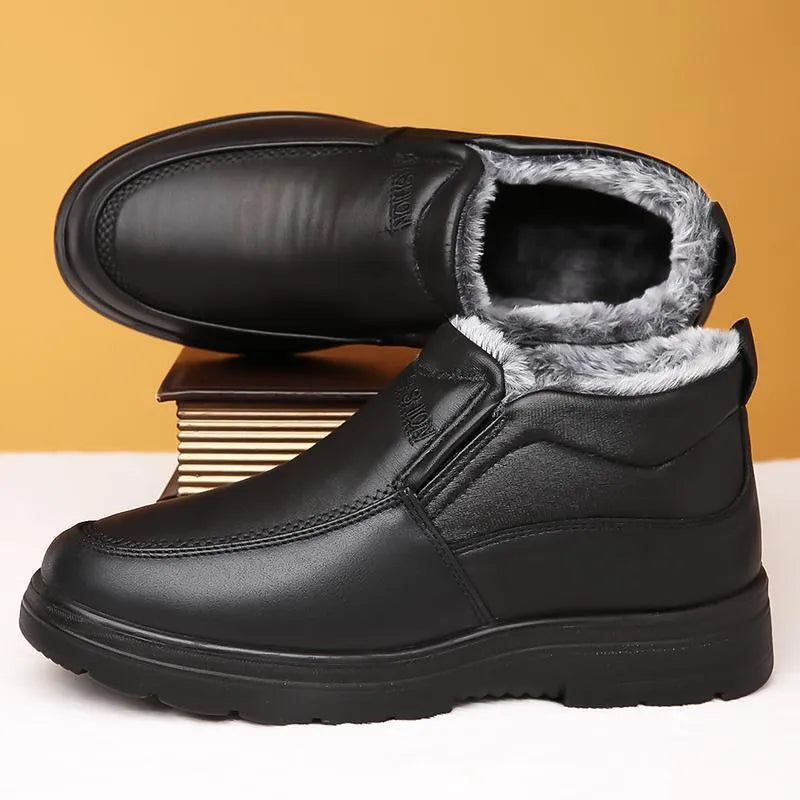 Men's black winter slip-on shoes with fleece lining and a textured non-slip rubber sole.