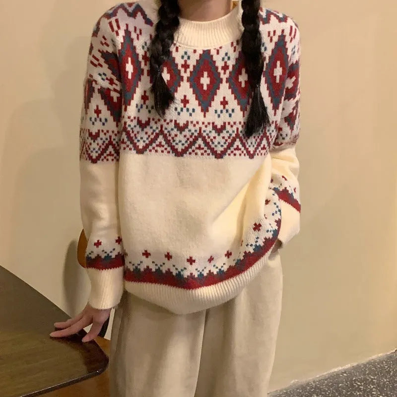 Red and white striped loose fit long sleeve knitted pullover top on a hanger.