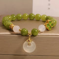 Women's green tourmaline bracelet with a four-leaf clover safety buckle in New Chinese style.