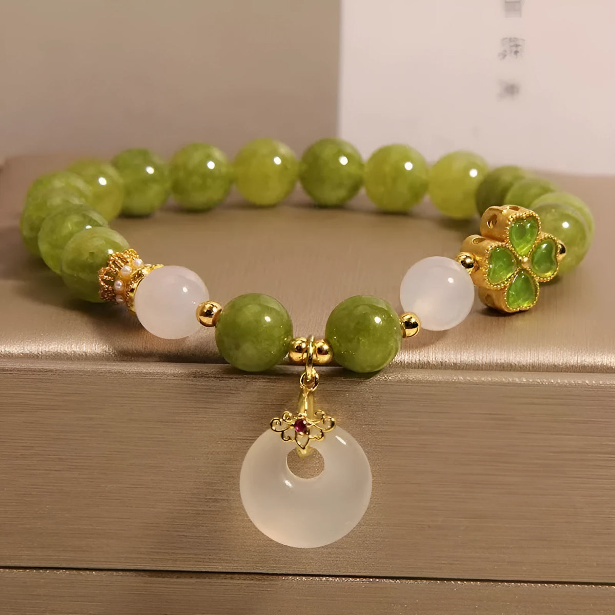 Women's green tourmaline bracelet with a four-leaf clover safety buckle in New Chinese style.