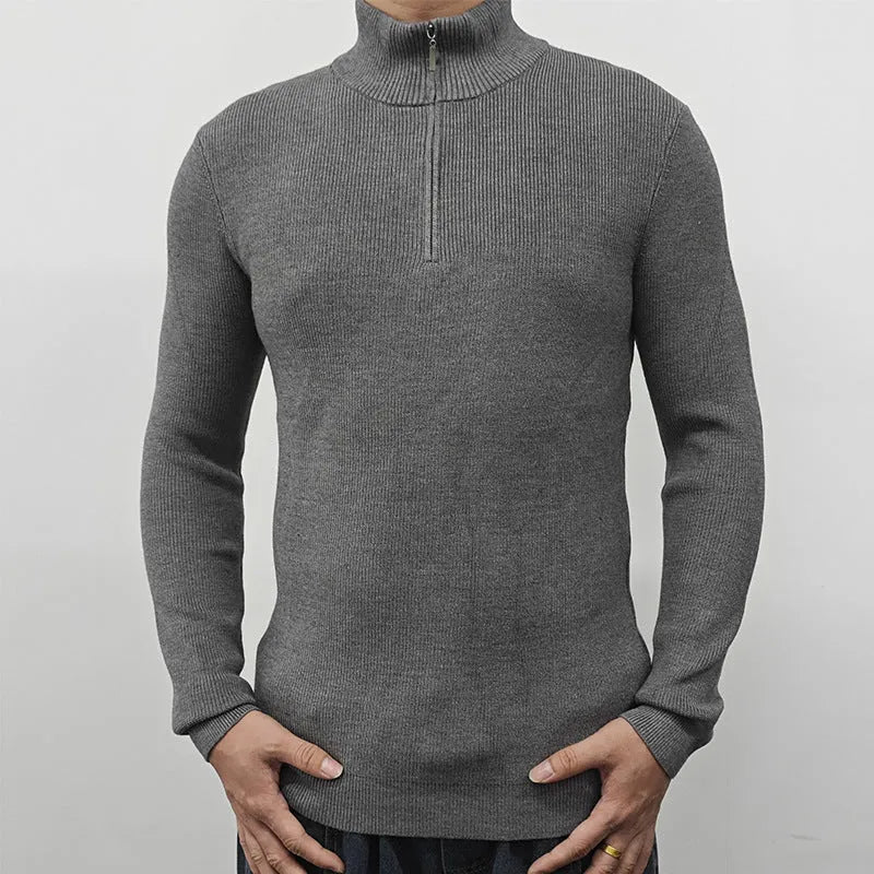 Men's grey half-turtleneck zip-front sweater made from cotton blend fabric.