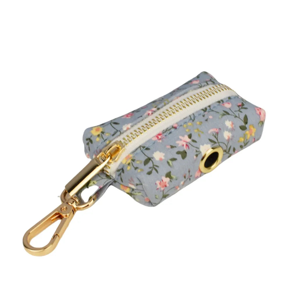 Blue floral pattern dog collar set with adjustable sizing and multiple accessory pieces