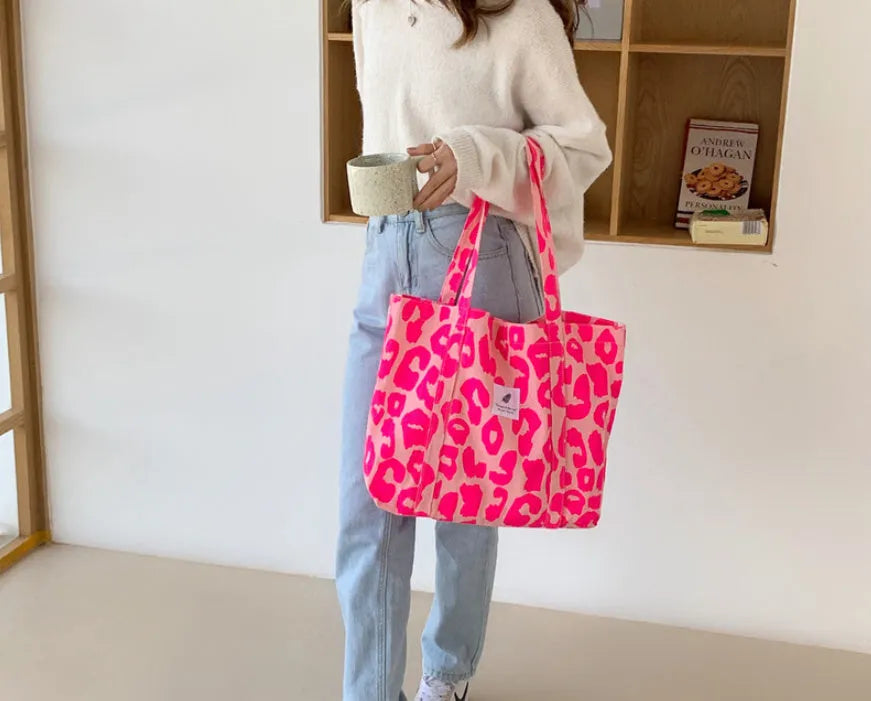 Oxford cloth women's shoulder bag with three-dimensional pockets in colour options including black, pink, and sapphire blue