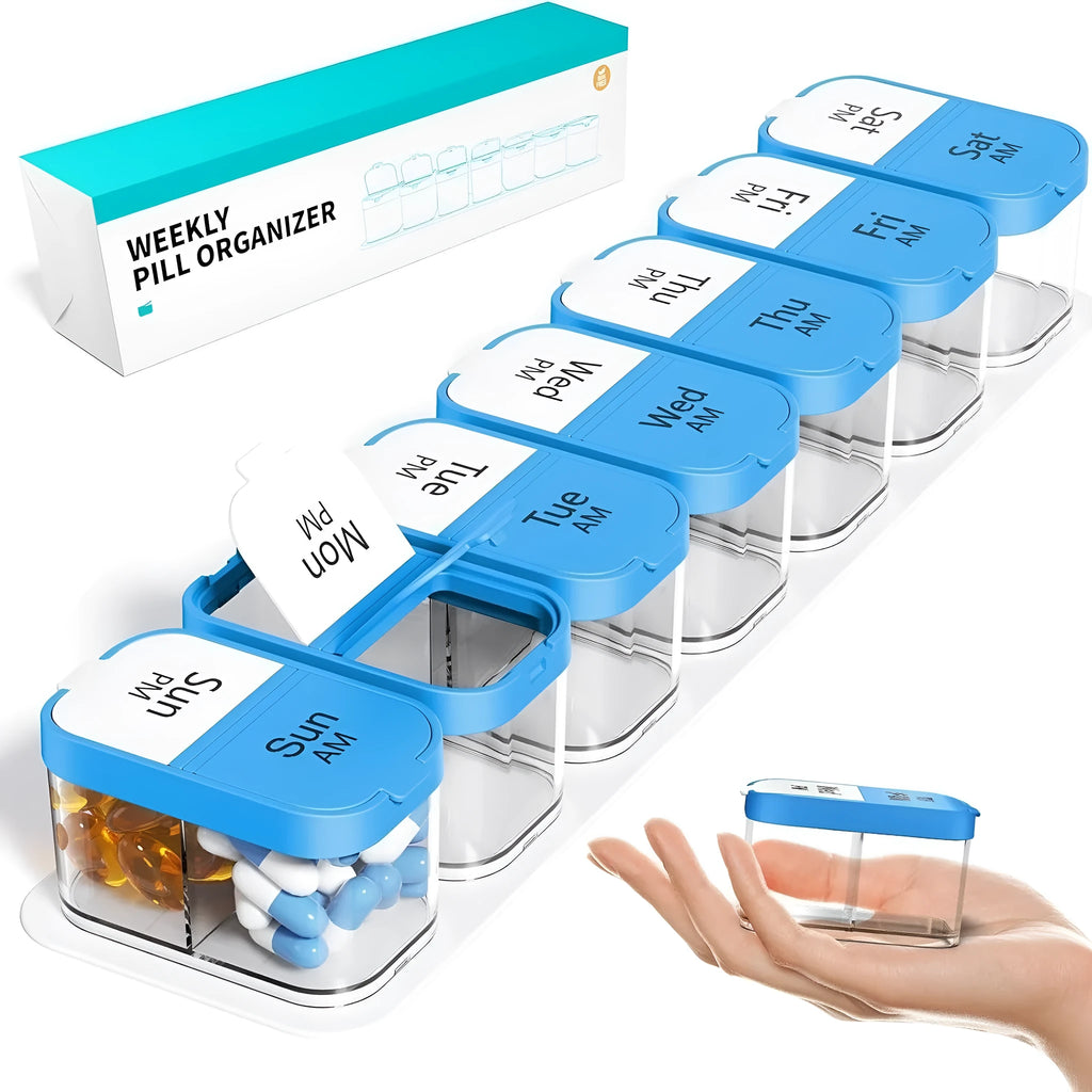 Extra large white plastic pill dispenser with 14 removable rainbow-coloured grid compartments open on a table.