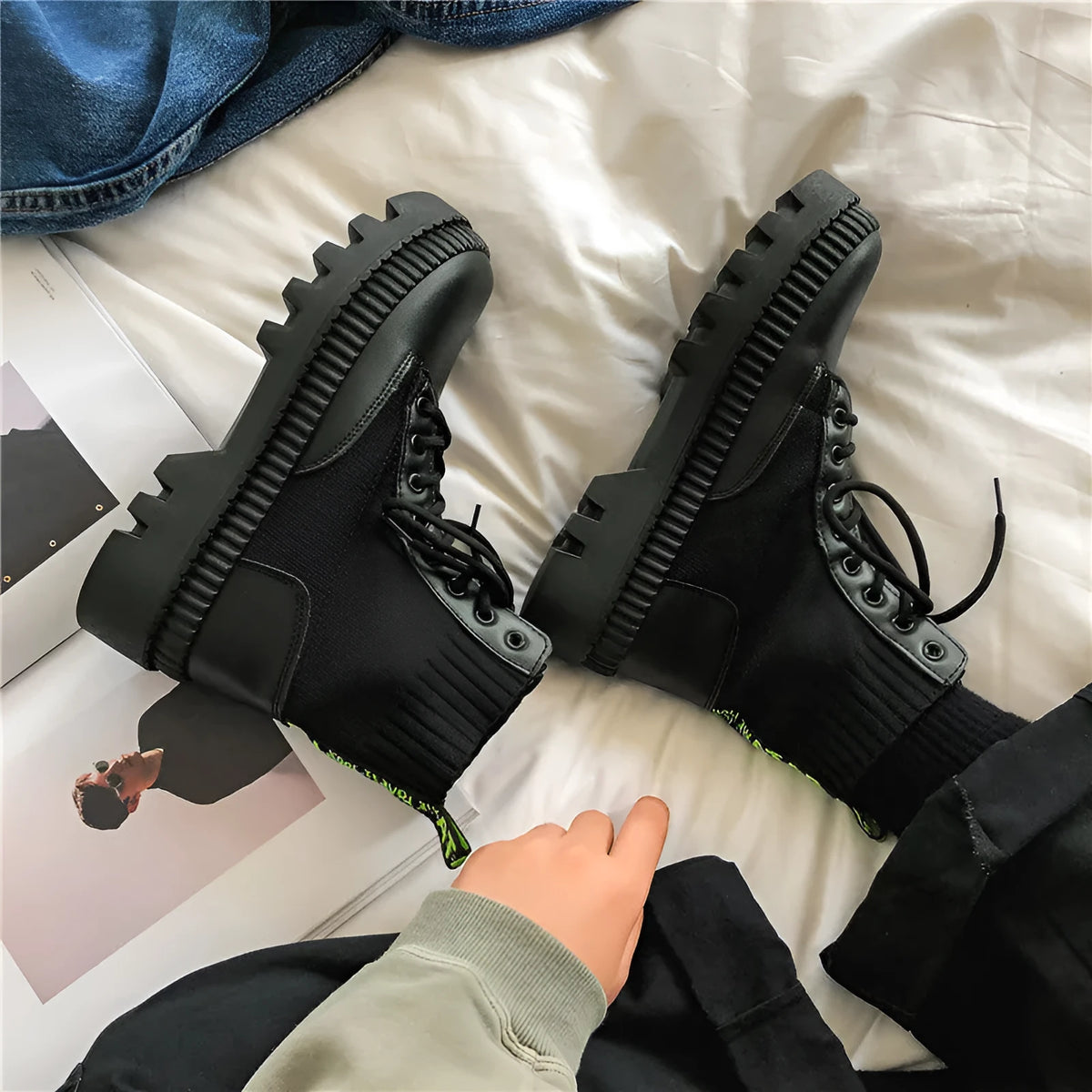 Men's black frosted leather Doc Martens platform boots with a side zip and high-top design.