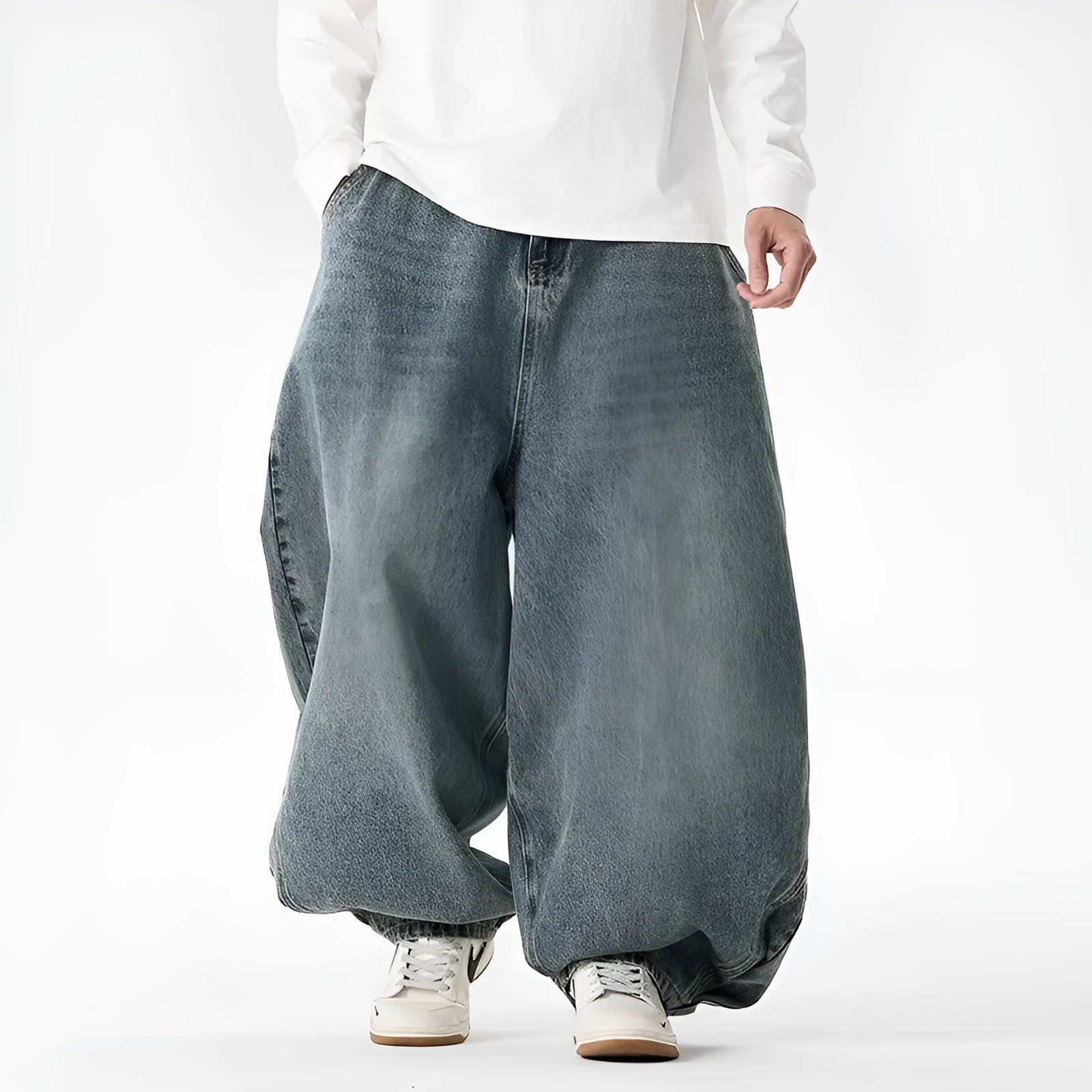 Men's loose fit plus size jeans in dark blue denim showing wide leg and low waist style.