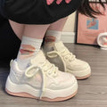 Women's green patent leather platform sneakers with lace-up front and rubber soles