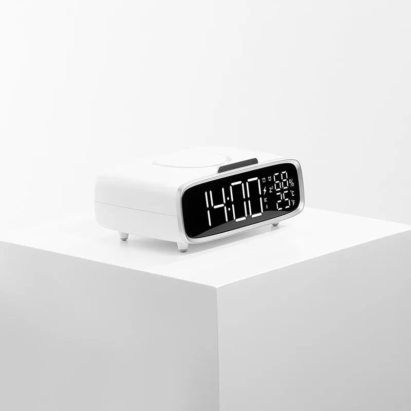 White 3-in-1 bedside unit with wireless charging pad, Bluetooth speaker, and night light.