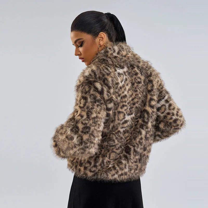 Women's leopard print street fashion coat with a buckle detail on the lapel.