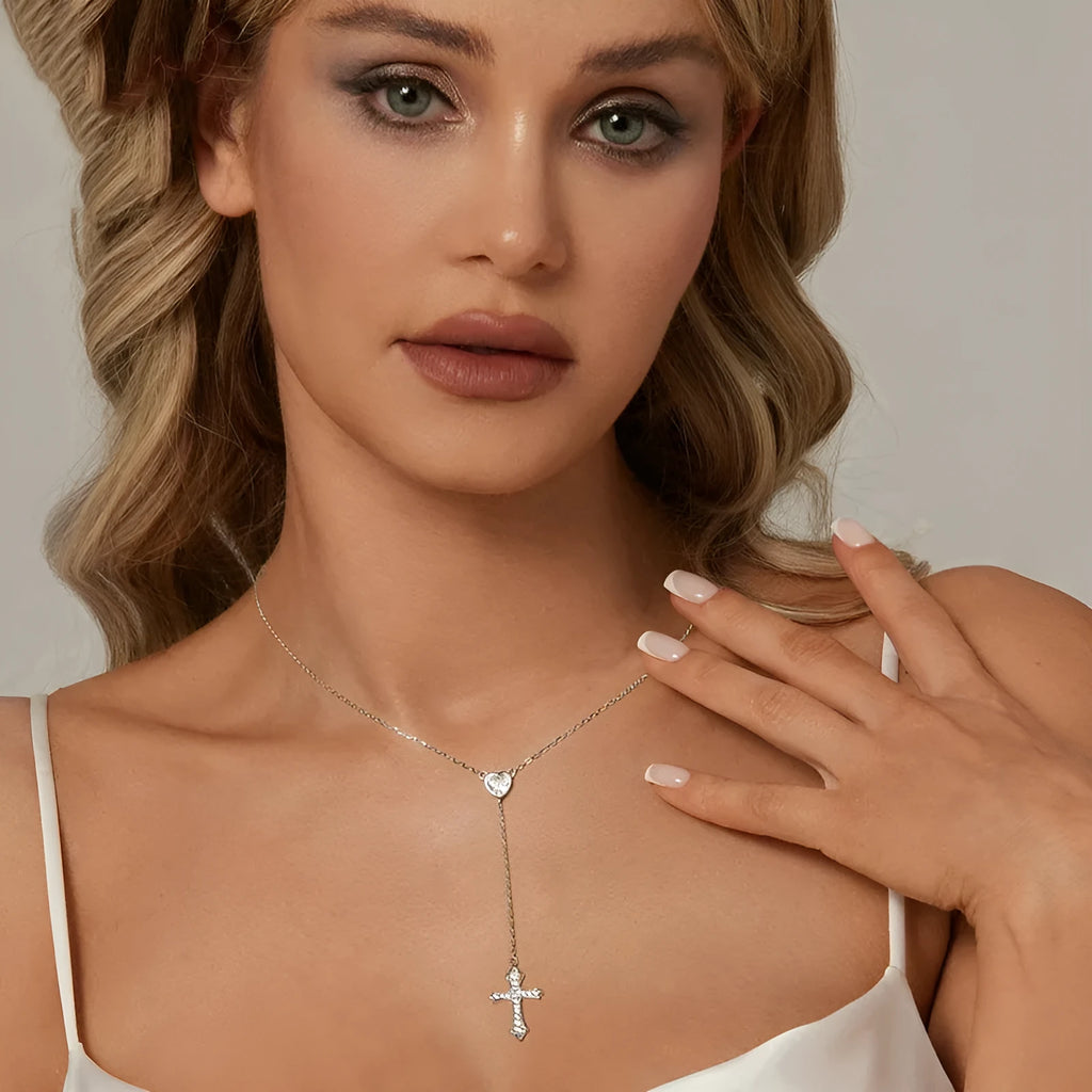 Close-up of a sterling silver V-neck cross pendant on an O-ring chain, colour BSN384.