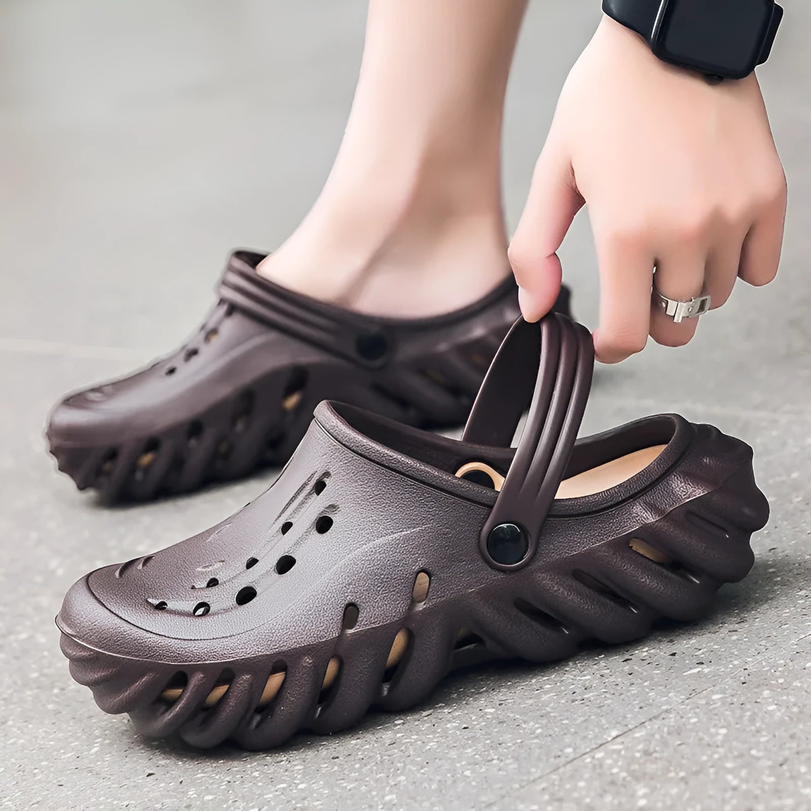 Men's beige EVA slipper sandals with hollow out design and round toe on a non-slip sole.