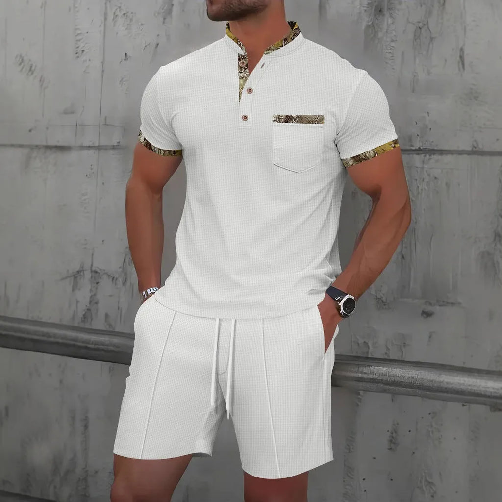Men's grey zip-front polo collar short sleeve jacket and matching shorts set laid flat.