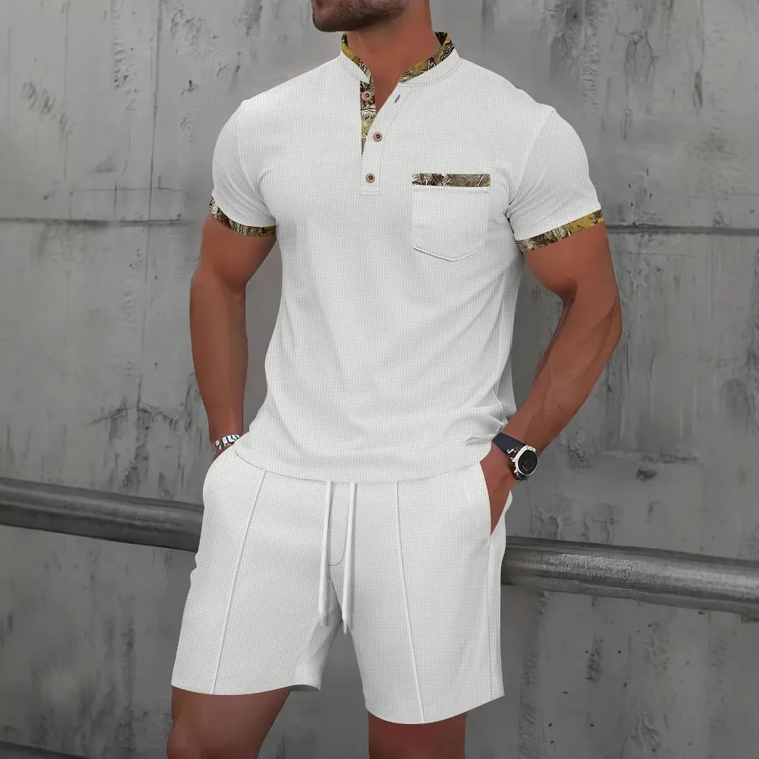 Men's grey zip-front polo collar short sleeve jacket and matching shorts set laid flat.